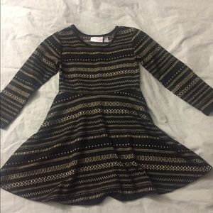 Gold and black children’s place dress.